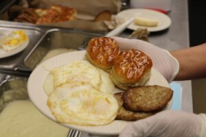 Plate of Eggs, Sausage, and Rolls